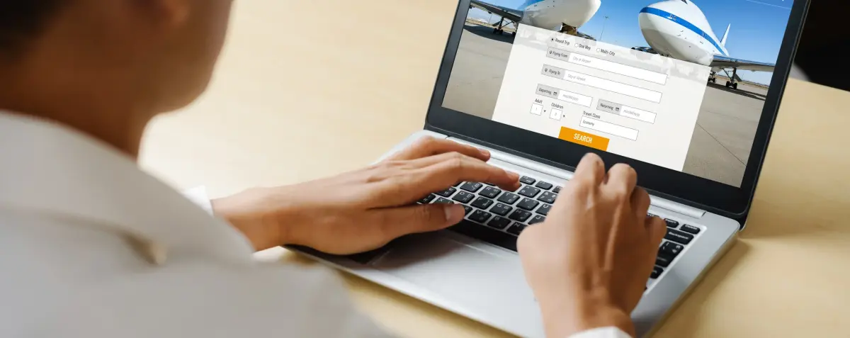 Traveler searching and booking flights for scraping airfare and travel industry data