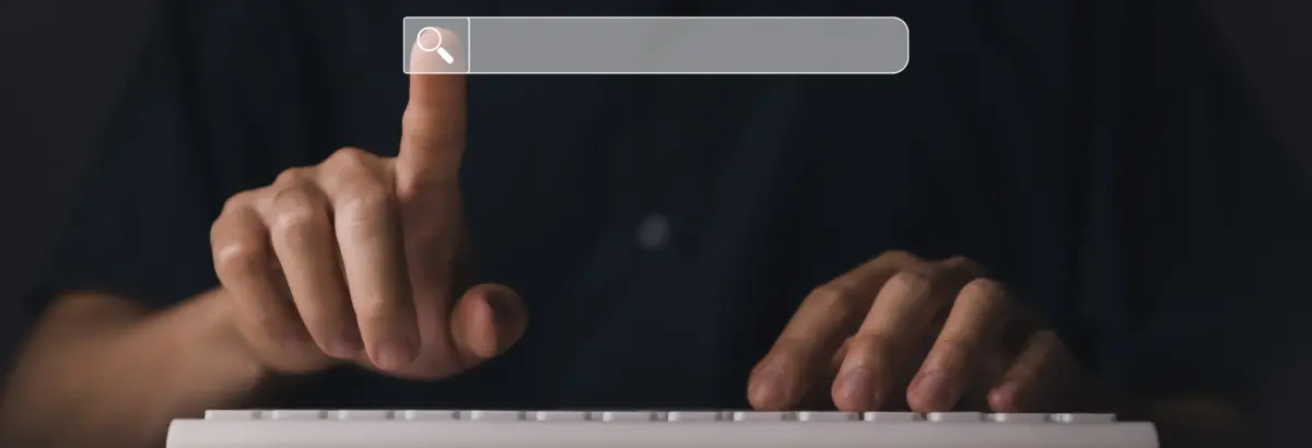 User typing on keyboard to extract all URLs from a website using search interface and scraping tools