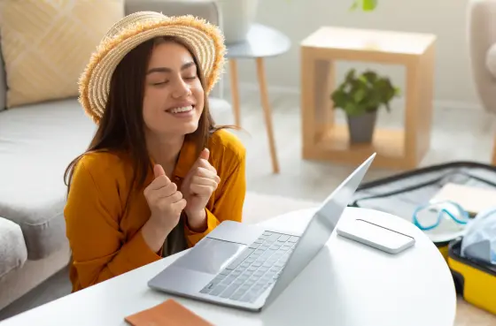 Excited-woman-using-notebook-for-data-scraping-1-scaled