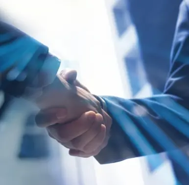 Business handshake with light effects