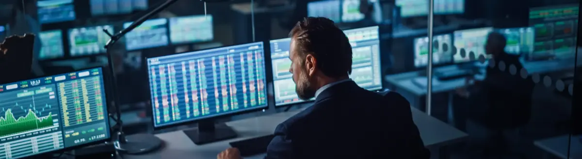 Data analyst monitoring financial data aggregation dashboards for US business intelligence and market analysis